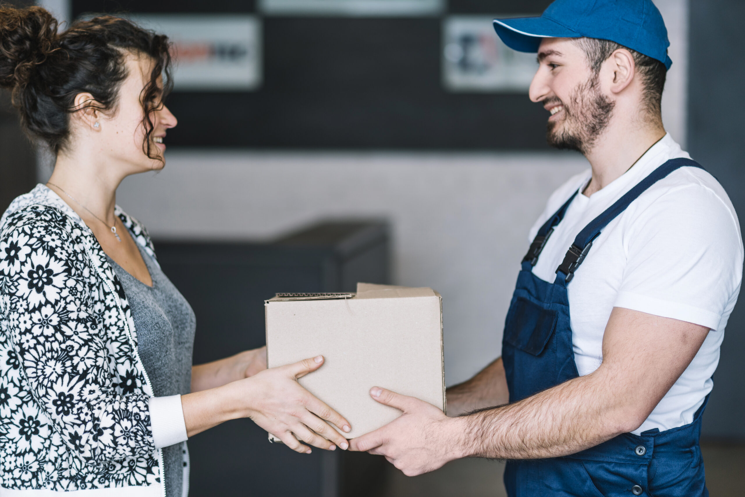 smiling-woman-courier-with-parcel